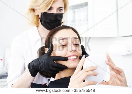 Teeth Whitening. Correction Of Malocclusion. Dental Treatment At The Dental Center. Dentist And Pati