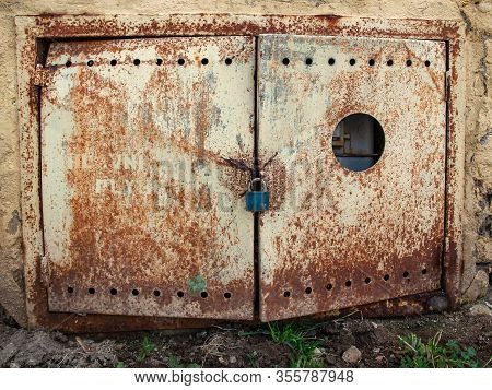 Tin Door, Rusted And Swrapped With Padlock, Interesting Object For Use In Graphics Or Collage