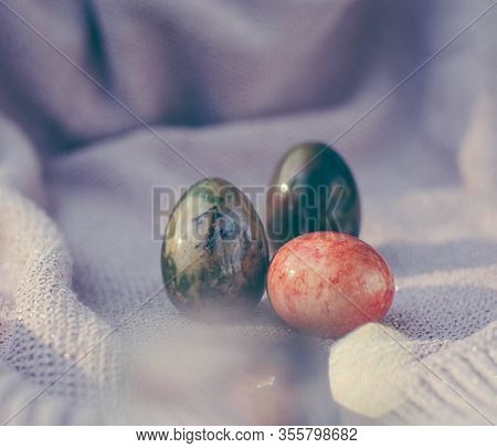 Easter Background With Easter Eggs. Soft Focus, Bokeh Effect. Happy Easter Greeting Card Template In