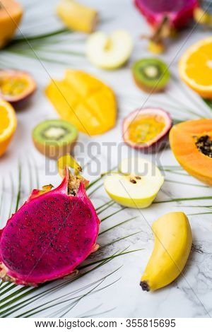Sliced Exotic Fresh Fruits On Table. Assorted Ripe Juicy Tropical Summer Seasonal Fruits And Tropica