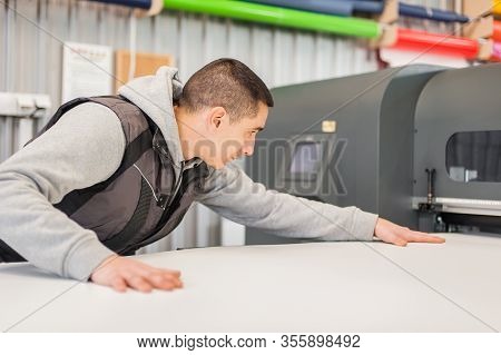 Technician Operator Works On Large Premium Industrial Printer Plotter Machine