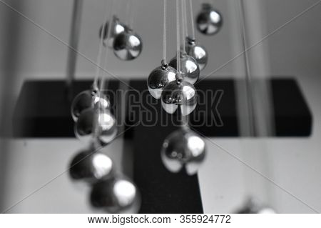 Business Concept For Strategy Team Work And Alignment. Newtons Cradle Pendulum.