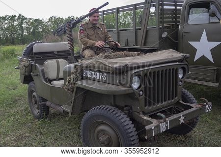 Kiev, Ukraine - May 09, 2018: Mens In The Form Of American Soldiers And An American Army Jeep At A H