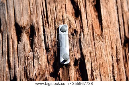 Metal I Is Embedded In Rustic Post