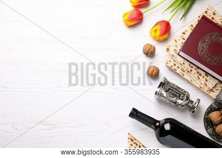 Flat Lay Composition With Symbolic Pesach (passover Seder) Items On White Wooden Table, Space For Te