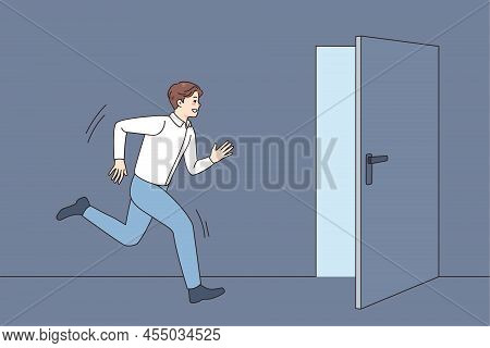 Young Man Running Into Open Door Strive For Happy Future And Career Success. Male In Hurry Move Towa
