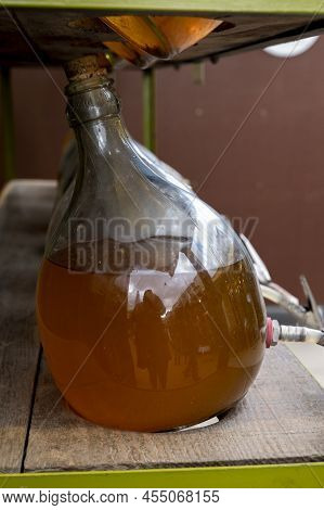 Big Bottles With White Wine Austrian Vinegar Made From Local Grapes On Market In Vienna, Austria