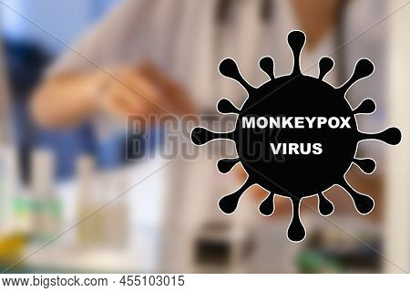 Monkeypox. Nurse. Medical. Text Written On An Unfocused Background And Virus Design Of A Nurse With 