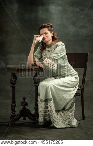 Conceptual Portrait Of Young Charming Girl In Image Of Medieval Royal Person Or Viscountess Crying I