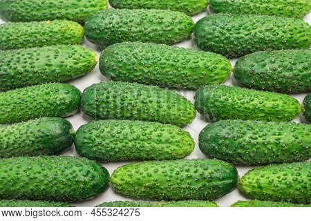 Fresh Green Cucombers As A Background. Top View.