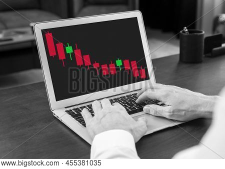 Man Working With Declining Candlestick Graph At Laptop. Down Movement In Product Price. Crisis, Stoc