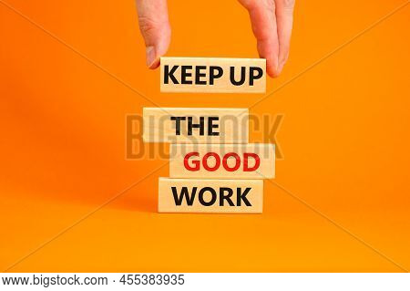 Keep Up The Good Work Symbol. Concept Words Keep Up The Good Work On Wooden Blocks. Businessman Hand