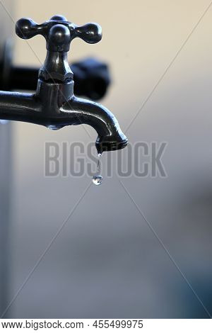 Ilheus, Bahia, Brazil - May 22, 2022: Water Drop Falling From A Leaking Faucet In The City Of Ilheus