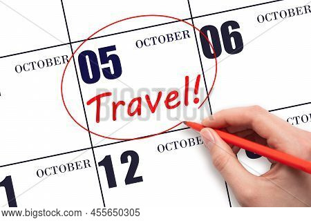 5th Day Of October. Hand Drawing A Red Circle And Writing The Text Travel On The Calendar Date 5 Oct