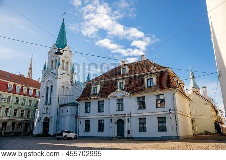 Riga, Latvia, 19 October 2021: White Roman Catholic Our Lady Of Sorrows Church With Tower At 5 Pils 