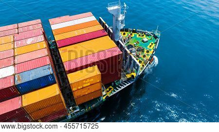 Aerial Side View Of Cargo Ship Carrying Container And Running For Export  Goods  From  Cargo Yard Po