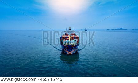 Aerial In Front View Of Cargo Ship Carrying Container And Running For Export  Goods  From  Cargo Yar
