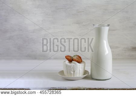 Jar Of Milk, Ricotta Cheese, Fresh Strawberries For Jewish Holiday Shavuot On White Wooden Backgroun