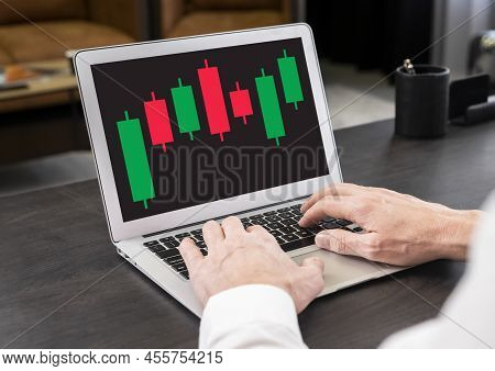 Businessman Working With Candlestick Graph At Laptop. Stock Value Behavior Analysis. Investment, Ana