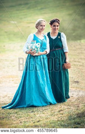 Moscow, Russia - June 23, 2013: Two Medieval Girls In Traditional  Period Dresses During The Great I