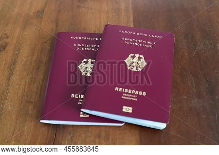Two German Passports On A Wooden Background For Passport Control