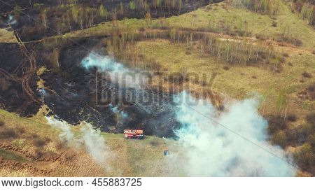 Bush Fire And Smoke. Drought Fire Engine, Truck On Firefighting Operation. Wild Open Fire Destroys G