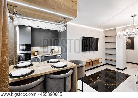 Served Dining Table With Soft Bar Chairs In Studio Apartment
