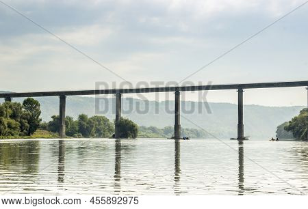 High Bridge Under Dnister River And People On Sport Catamarans, National Nature Park Dnister Canyon,
