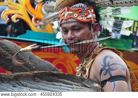 Jakarta, Indonesia - April 28, 2013 : A Participant At The Dayak Festival In Jakarta, Indonesia, Pos