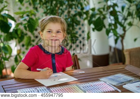 Happy Preschool Girl Learning Painting With Colorful Pencils And Felt Pens. Little Toddler Drawing A