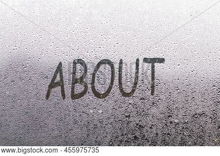 Foggy Glass On Window With Written Finger Word About