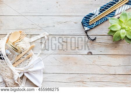 Zero Waste Concept. Cotton Bag, Bamboo Cutlery And Toothbrushes, Glass Jars, Metal And Bamboo Straws