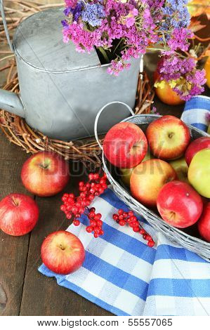 Juicy apples in basket on table close-up