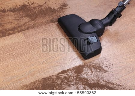 Vacuuming floor in house