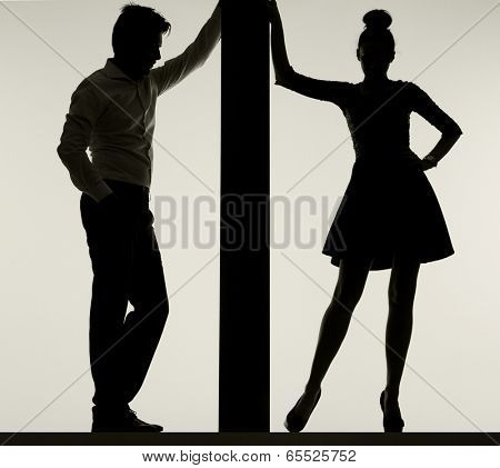 Young couple silhouette holding board