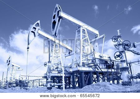 Pump Jack And Wellhead. Toned.