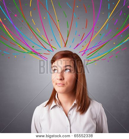 Pretty young girl thinking with colorful abstract lines overhead