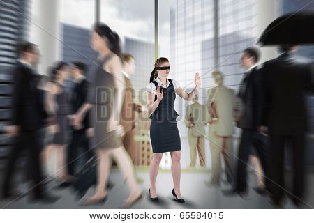 Redhead businesswoman in a blindfold against room with columns and view over city