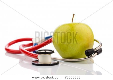 an apple and a stethoscope on a doctor. symbol photo for healthy and vitamin-rich diet.