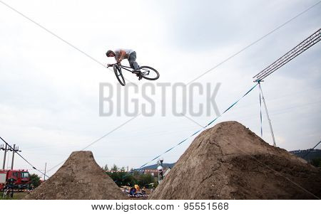 BONTIDA, ROMANIA - JUNE 27, 2015: Unidentified BMX rider making a bike jump during the BMX Competition, at Electric Castle Festival.