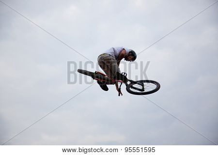 BONTIDA, ROMANIA - JUNE 27, 2015: Unidentified BMX rider making a bike jump during the BMX Competition, at Electric Castle Festival.