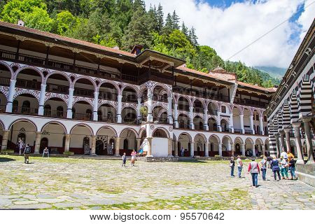 Tourists At The Territory Of Famous Rila Monastery, Bulgaria