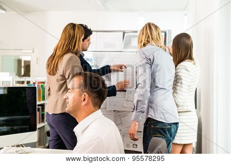 Businesspeople working in office