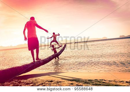 Father Playing With Sons At Tropical Beach With Tilted Horizon - Concept Of Family Union