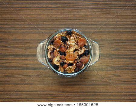 Dried berries and fruits on wooden table
