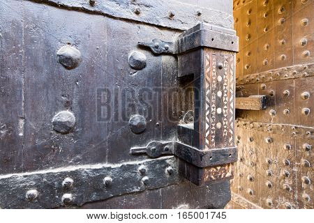 Wooden old latch of the wooden ancient gate of the caravansary (Wikala) of Bazaraa Cairo Egypt