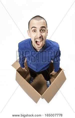 Man in a cardboard box on a white background
