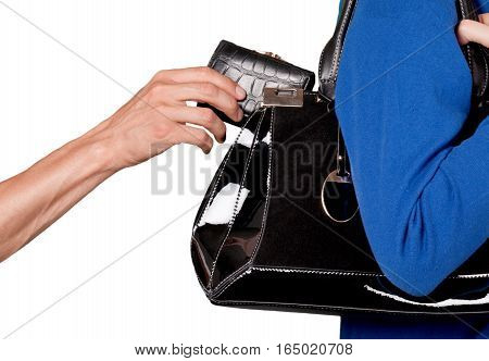 Pick pocket taking a wallet from a purse