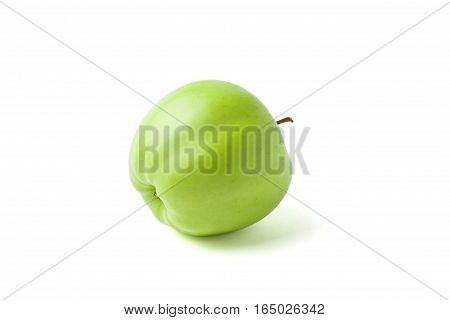 ripe green apple lying on its side on a white background
