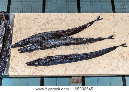 Black scabbard fish (espada in portuguese) in fish market of Funchal Madeira Portugal. Fish from Atlantic ocean.